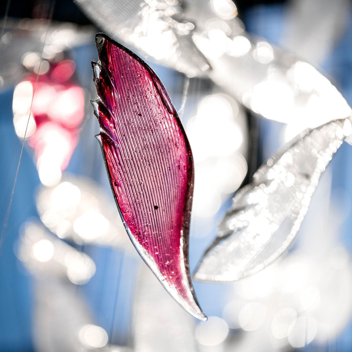 Zathaara Glass Feather Shape Chandelier