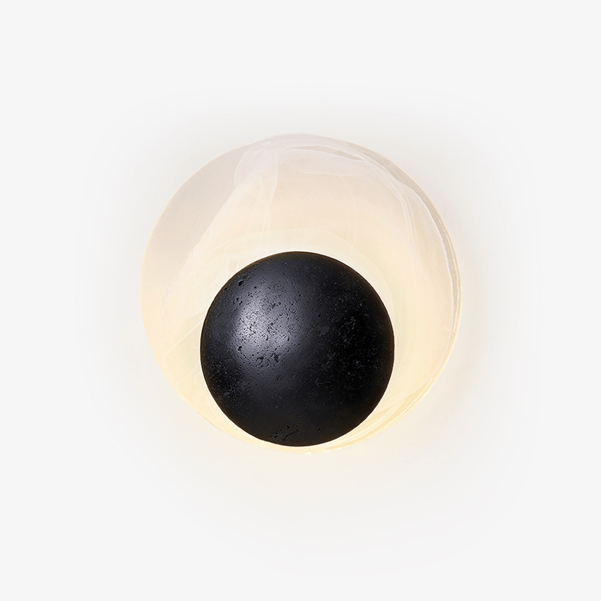 Orla Cosmica Eclipse Black Travertine Shell Wall Lamp