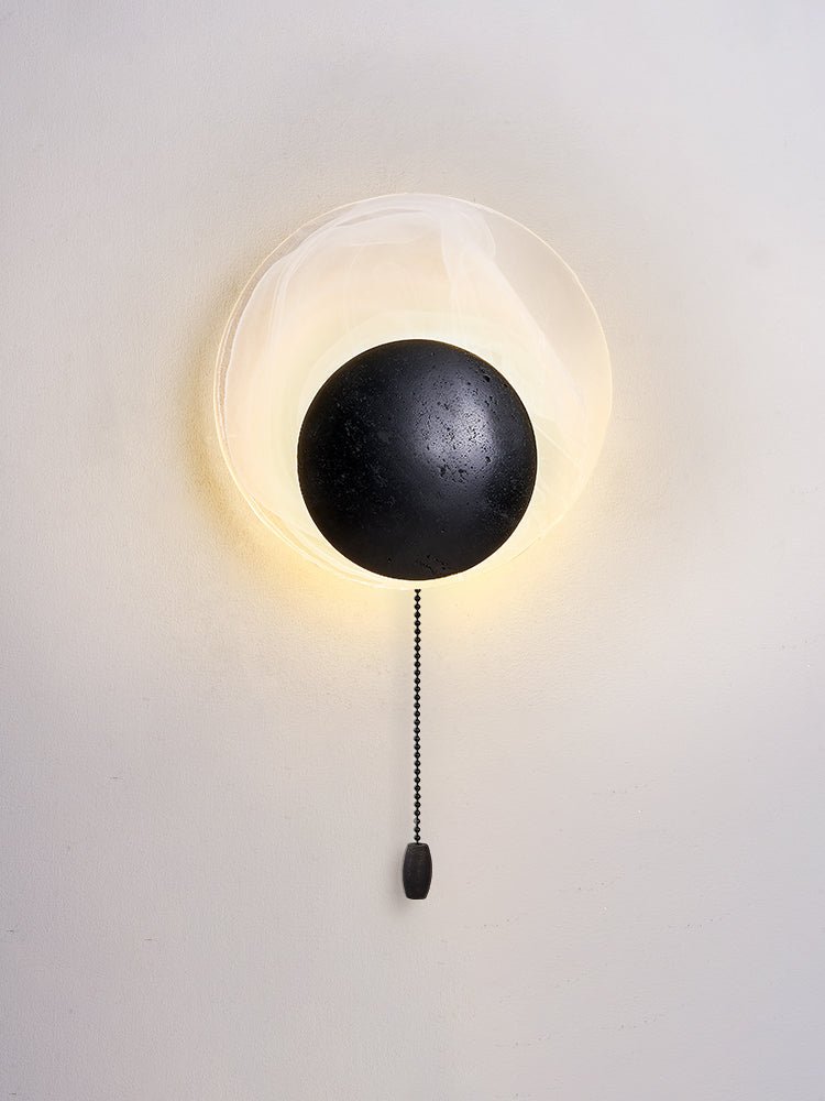Orla Cosmica Eclipse Black Travertine Shell Wall Lamp