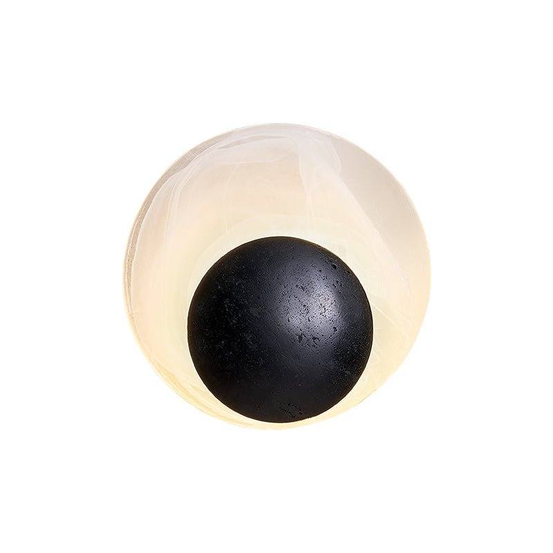 Orla Cosmica Eclipse Black Travertine Shell Wall Lamp