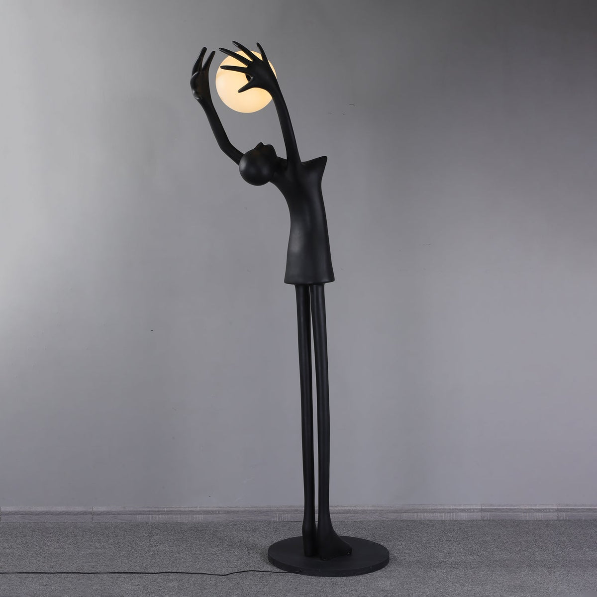 Lynorel Figurative Black Floor Lamp
